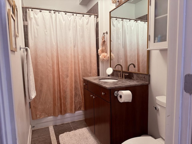 4722 N Beacon St Unit 1E, Chicago, IL 60640 - bathroom with toilet, vanity, tile patterned flooring, and shower / tub combo with curtain