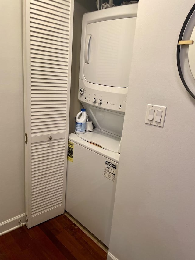4722 N Beacon St Unit 1E, Chicago, IL 60640 - washroom with stacked washing machine and dryer, dark wood-type flooring, and baseboards