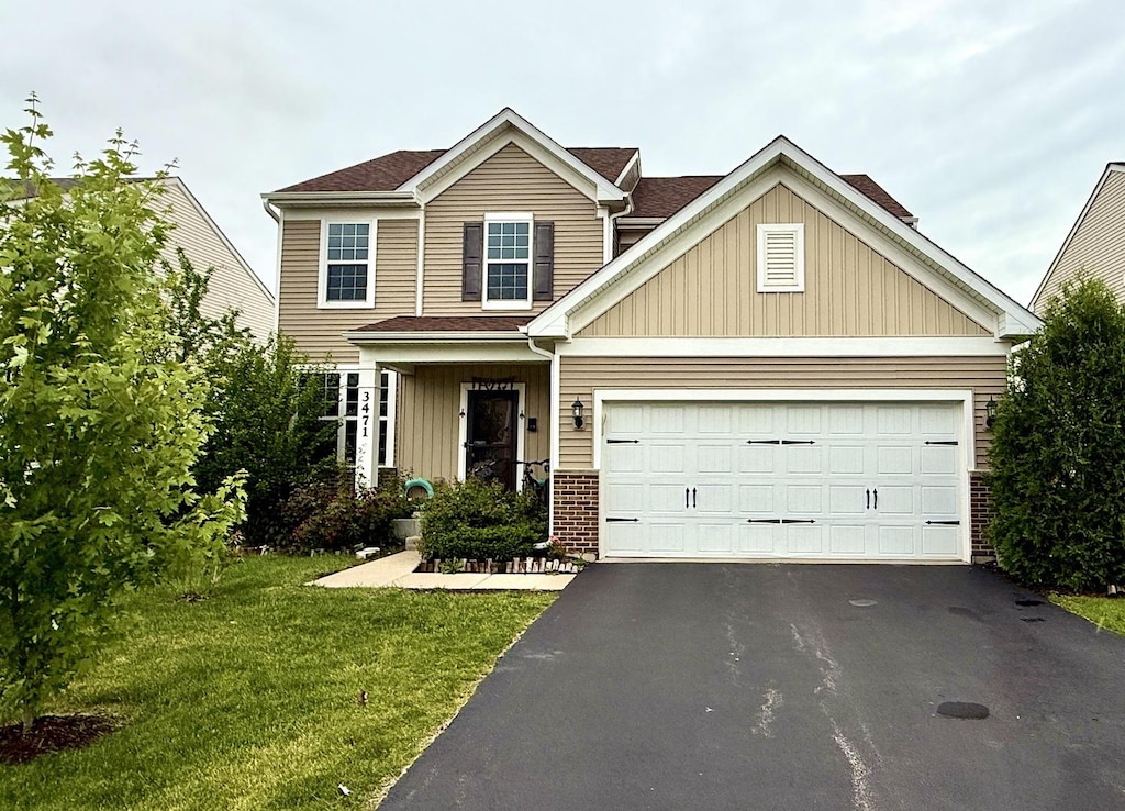 3471 Birch Ln, Naperville, IL 60564 - view of front facade featuring driveway, a front yard, a garage, and brick siding