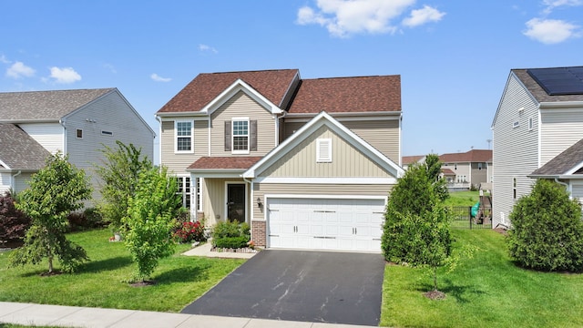 3471 Birch Ln, Naperville, IL 60564 - traditional-style house featuring board and batten siding, a front yard, an attached garage, and asphalt driveway