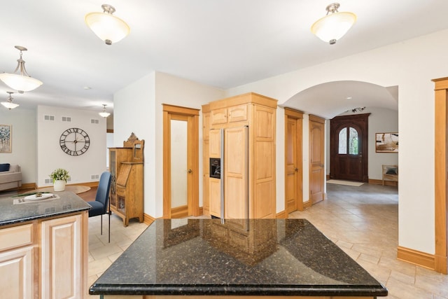 557 Signal Hill Rd, North Barrington, IL 60010 - kitchen with paneled built in fridge, arched walkways, light brown cabinets, baseboards, and dark stone counters