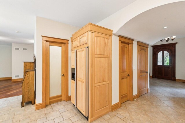 557 Signal Hill Rd, North Barrington, IL 60010 - entryway with arched walkways, baseboards, and a chandelier