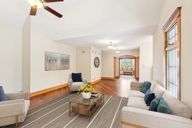 557 Signal Hill Rd, North Barrington, IL 60010 - living room featuring wood finished floors, arched walkways, ceiling fan, baseboards, and vaulted ceiling