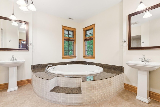 557 Signal Hill Rd, North Barrington, IL 60010 - bathroom featuring baseboards, tile patterned flooring, a garden tub, and a sink