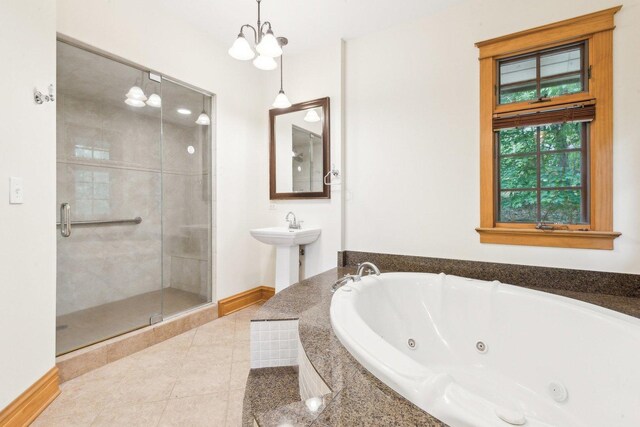 557 Signal Hill Rd, North Barrington, IL 60010 - full bathroom featuring a tub with jets, tile patterned floors, baseboards, a shower stall, and a sink