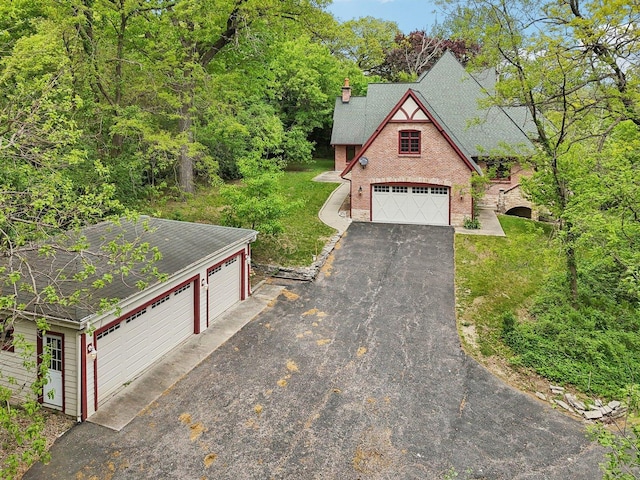 557 Signal Hill Rd, North Barrington, IL 60010 - view of front of house with roof with shingles, a garage, a front lawn, and a chimney