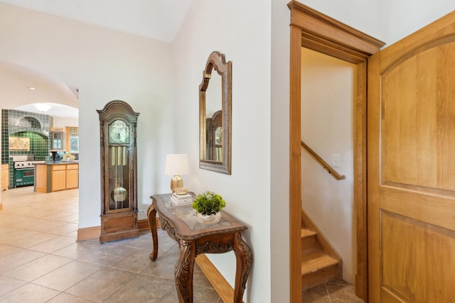 557 Signal Hill Rd, North Barrington, IL 60010 - hall with light tile patterned floors, arched walkways, and stairs