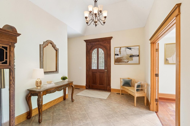 557 Signal Hill Rd, North Barrington, IL 60010 - foyer featuring a chandelier, baseboards, lofted ceiling, and light tile patterned floors