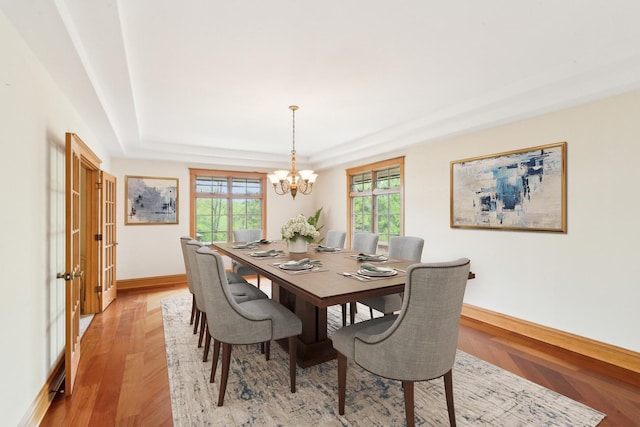 557 Signal Hill Rd, North Barrington, IL 60010 - dining area with a raised ceiling, baseboards, a chandelier, and french doors