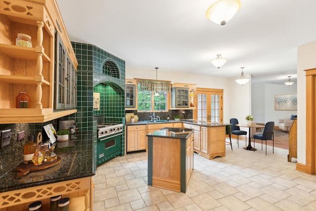 557 Signal Hill Rd, North Barrington, IL 60010 - kitchen featuring high end stainless steel range oven, a sink, tasteful backsplash, light stone finish flooring, and a center island