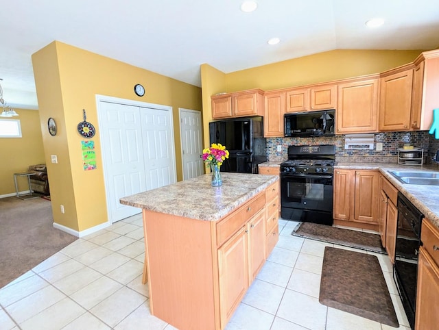 72 Astoria Way, Bloomington, IL 61704 - kitchen featuring black appliances, a sink, backsplash, a center island, and light brown cabinetry