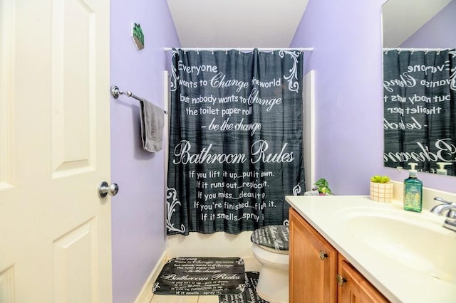 72 Astoria Way, Bloomington, IL 61704 - bathroom featuring vanity, toilet, tile patterned flooring, and baseboards