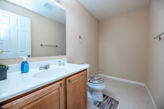 72 Astoria Way, Bloomington, IL 61704 - bathroom featuring toilet, vanity, and baseboards