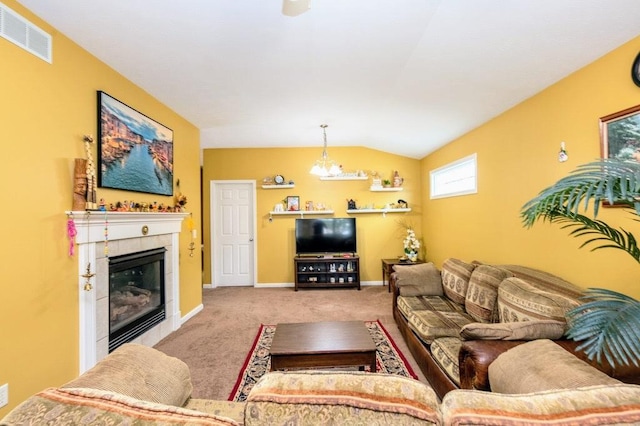 72 Astoria Way, Bloomington, IL 61704 - carpeted living room featuring vaulted ceiling, a tiled fireplace, and baseboards