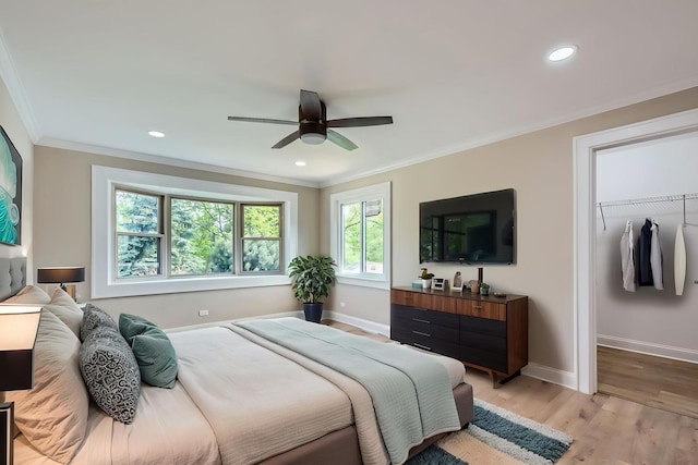 bedroom with ornamental molding, baseboards, light wood-type flooring, recessed lighting, and ceiling fan