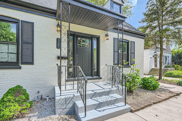 entrance to property with brick siding