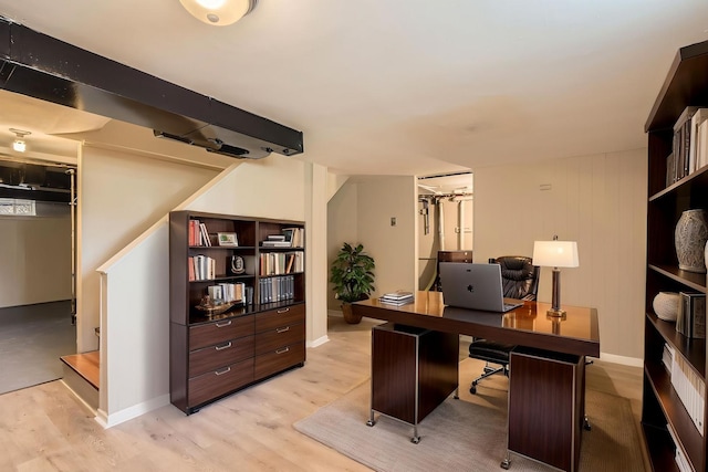 office space with light wood-style floors and baseboards
