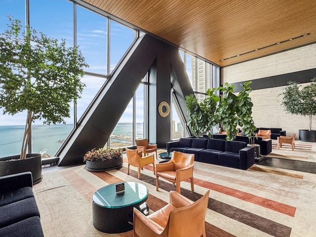 175 E Delaware Pl Unit 7511, Chicago, IL 60611 - lobby with floor to ceiling windows, a water view, and a high ceiling