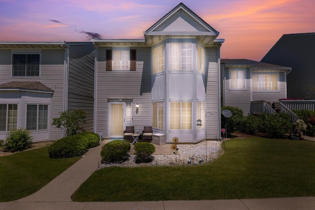 353 Evening Star Ct Unit 353, Bolingbrook, IL 60440 - view of front facade with a yard