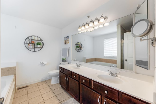 353 Evening Star Ct Unit 353, Bolingbrook, IL 60440 - bathroom with a garden tub, tile patterned flooring, double vanity, and baseboards
