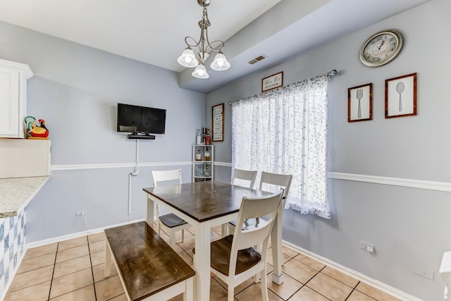 353 Evening Star Ct Unit 353, Bolingbrook, IL 60440 - dining area with light tile patterned flooring, baseboards, and a chandelier