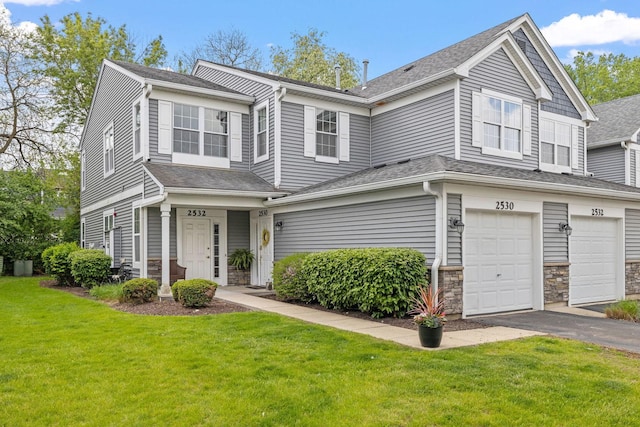 2530 Oneida Ln Unit 2530, Naperville, IL 60563 - townhome / multi-family property featuring driveway, a front lawn, a garage, stone siding, and a shingled roof