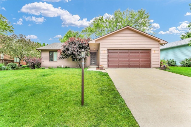 2805 Susan Stone Dr, Urbana, IL 61802 - view of front of home featuring driveway, a front lawn, and a garage