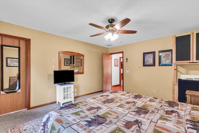 2805 Susan Stone Dr, Urbana, IL 61802 - carpeted bedroom with a textured ceiling, baseboards, and a ceiling fan