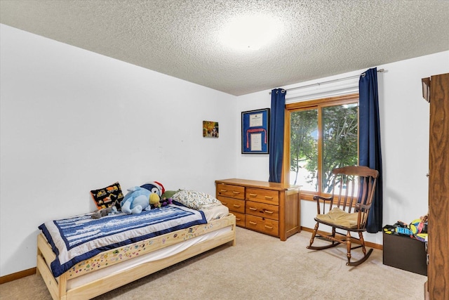 2805 Susan Stone Dr, Urbana, IL 61802 - bedroom featuring light colored carpet, a textured ceiling, and baseboards