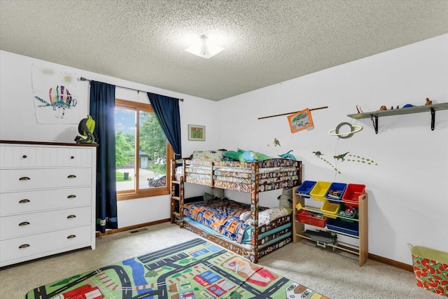 2805 Susan Stone Dr, Urbana, IL 61802 - bedroom featuring a textured ceiling, light colored carpet, and baseboards