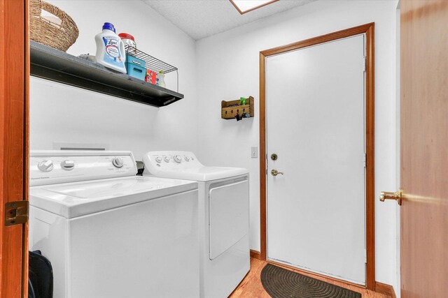 2805 Susan Stone Dr, Urbana, IL 61802 - laundry room featuring washing machine and clothes dryer and light wood-type flooring
