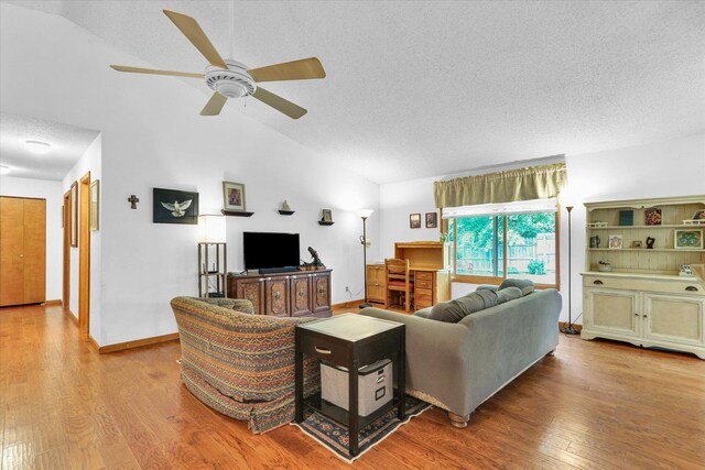 2805 Susan Stone Dr, Urbana, IL 61802 - living room with a textured ceiling, ceiling fan, wood finished floors, baseboards, and high vaulted ceiling