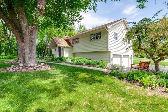 6316 Lake Shore Dr, Cary, IL 60013 - view of front of house featuring an attached garage and a front lawn