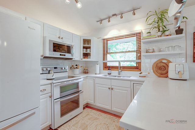 6316 Lake Shore Dr, Cary, IL 60013 - kitchen featuring white appliances, a sink, open shelves, backsplash, and white cabinetry