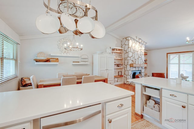 6316 Lake Shore Dr, Cary, IL 60013 - kitchen featuring a fireplace, healthy amount of natural light, light wood-style floors, and open floor plan