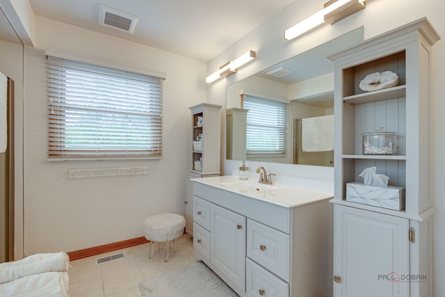 6316 Lake Shore Dr, Cary, IL 60013 - full bathroom with plenty of natural light, vanity, tile patterned floors, and baseboards