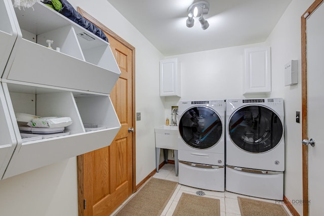 6316 Lake Shore Dr, Cary, IL 60013 - washroom with independent washer and dryer, cabinet space, light tile patterned floors, and baseboards