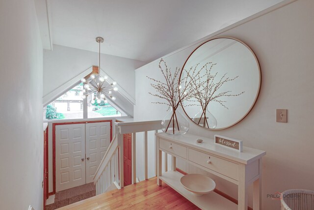 6316 Lake Shore Dr, Cary, IL 60013 - stairs with a chandelier and wood finished floors