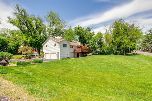 6316 Lake Shore Dr, Cary, IL 60013 - view of grassy yard featuring a garage, a deck, and driveway