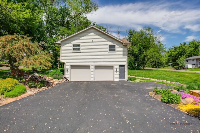 6316 Lake Shore Dr, Cary, IL 60013 - view of home's exterior with driveway, an attached garage, and a lawn
