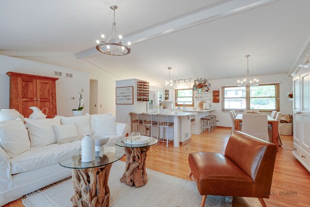 6316 Lake Shore Dr, Cary, IL 60013 - living room with a chandelier and light wood-type flooring