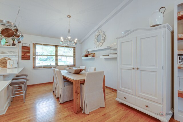 6316 Lake Shore Dr, Cary, IL 60013 - dining space featuring lofted ceiling, a chandelier, light wood finished floors, and baseboards