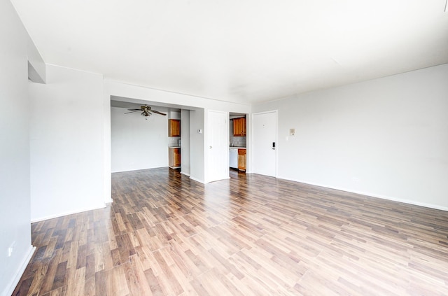 12741 S Lacrosse Ave Unit 3A, Alsip, IL 60803 - empty room with wood finished floors, ceiling fan, and baseboards