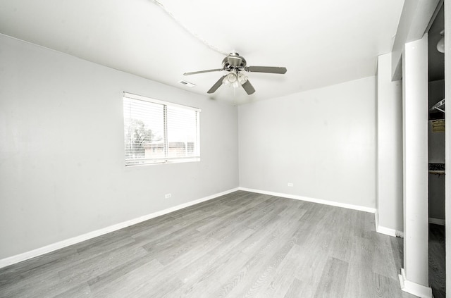 12741 S Lacrosse Ave Unit 3A, Alsip, IL 60803 - spare room with a ceiling fan, wood finished floors, and baseboards