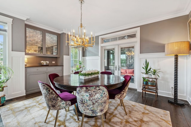 4532 Douglas Rd, Downers Grove, IL 60515 - dining room featuring a chandelier, a wainscoted wall, a decorative wall, dark wood-style flooring, and french doors