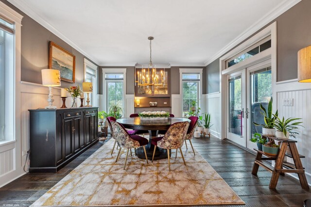 4532 Douglas Rd, Downers Grove, IL 60515 - dining space featuring french doors, a chandelier, ornamental molding, healthy amount of natural light, and a decorative wall