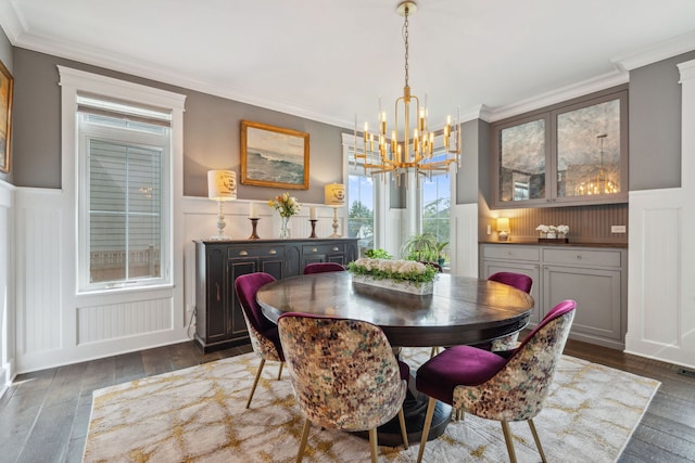 4532 Douglas Rd, Downers Grove, IL 60515 - dining area featuring a chandelier, a wainscoted wall, a decorative wall, crown molding, and dark wood-type flooring