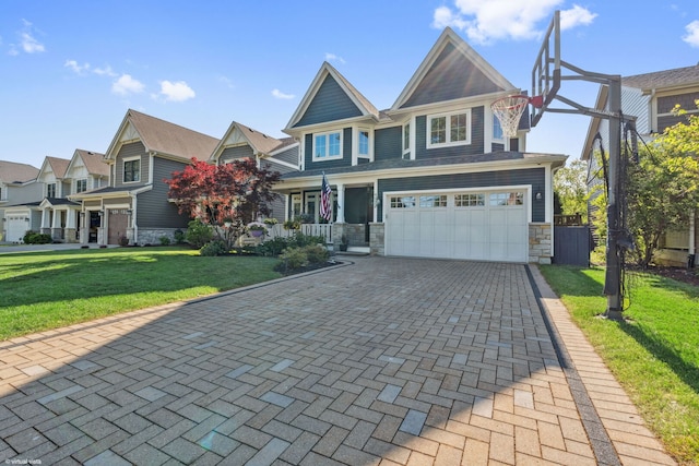 4532 Douglas Rd, Downers Grove, IL 60515 - craftsman-style home with stone siding, an attached garage, a front yard, driveway, and a porch