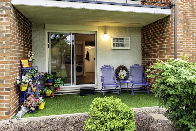 255 S W Ave Unit 101, Elmhurst, IL 60126 - view of exterior entry with brick siding and an AC wall unit