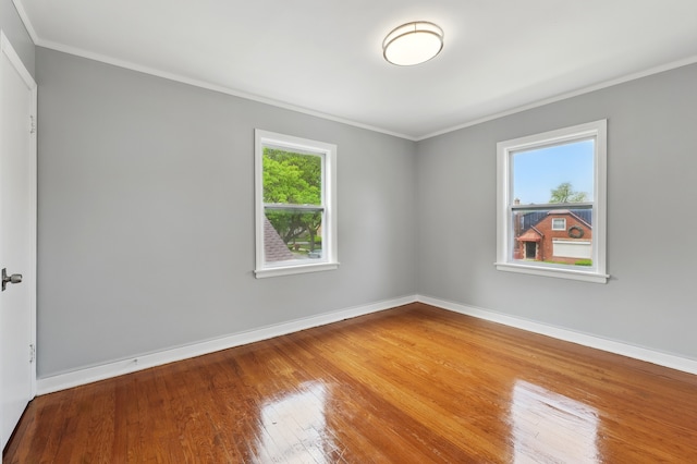 12137 S Perry Ave, Chicago, IL 60628 - spare room with ornamental molding, wood-type flooring, and baseboards